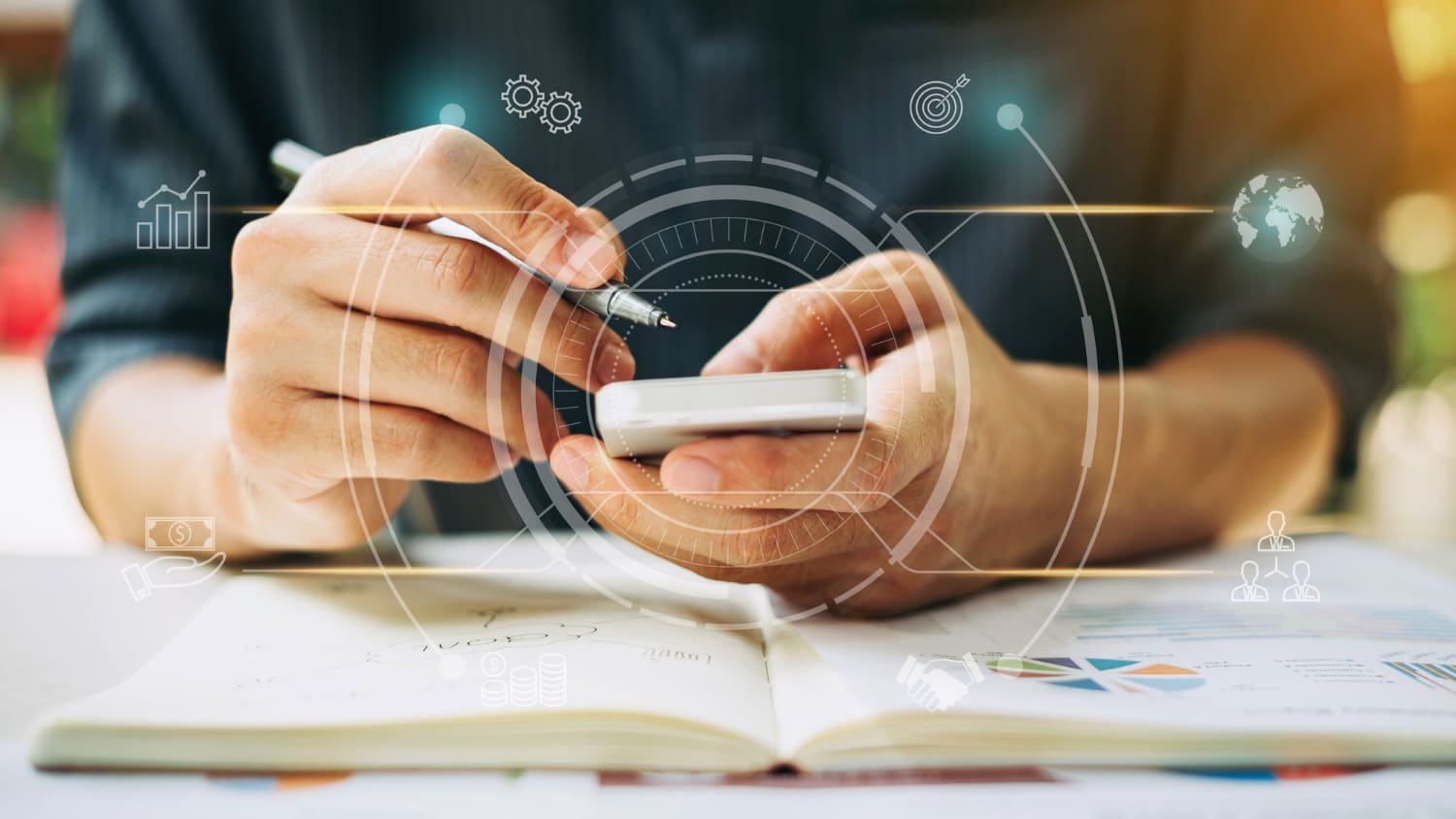 Person using a smartphone and notebook with overlaid icons representing analytics, goals, and collaboration